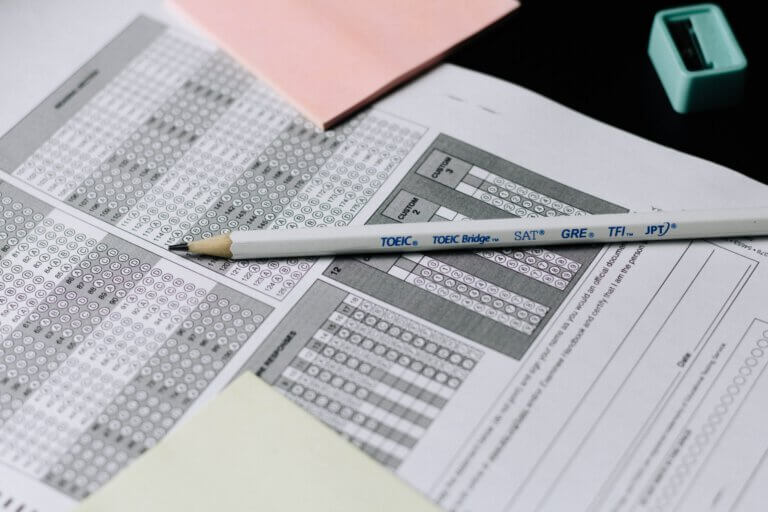 Exam sheets and pencil on table